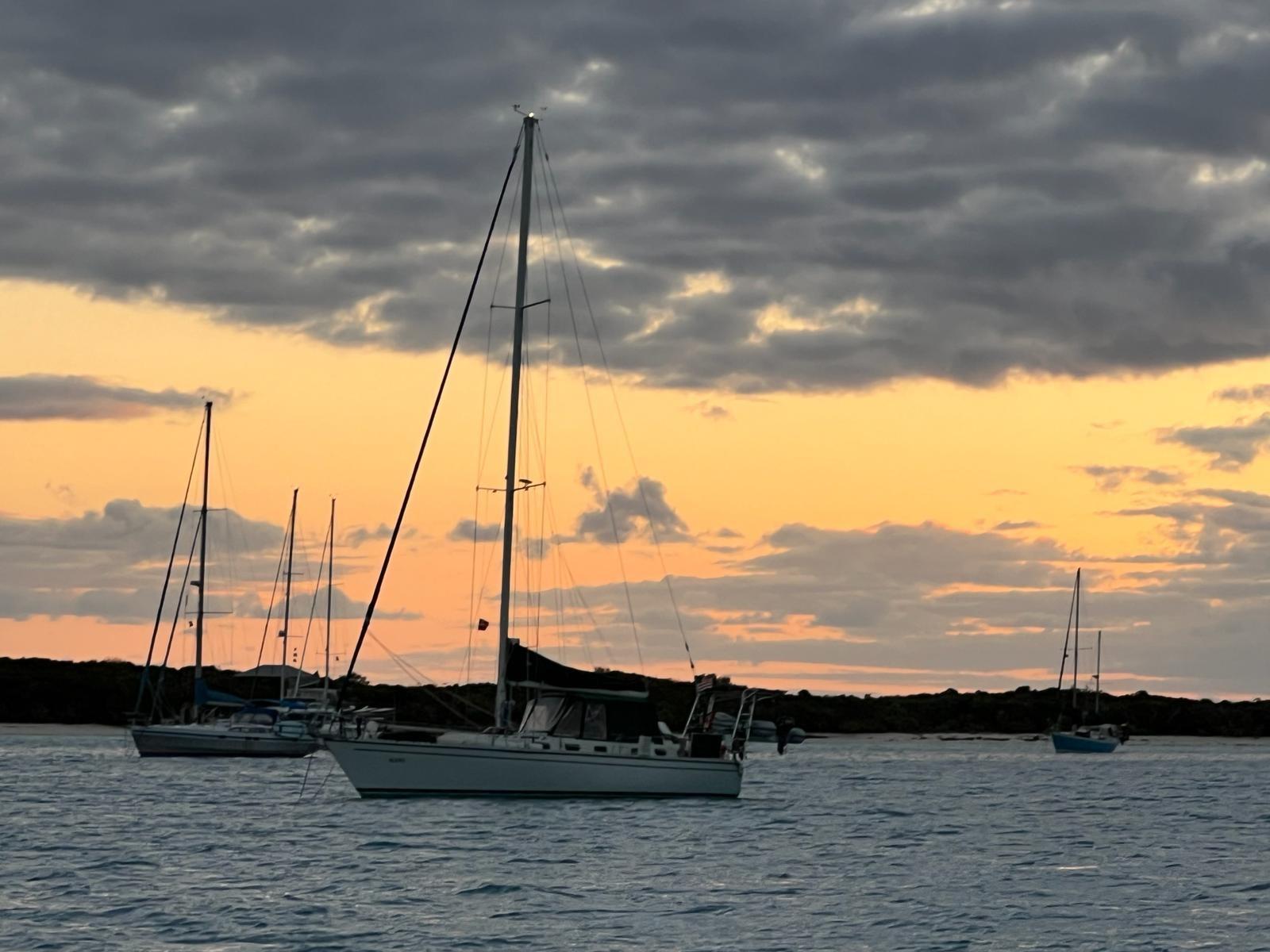 Catalina 44CC Sailboats anchored at sunset, featuring a 1990 Catalina 44CC.