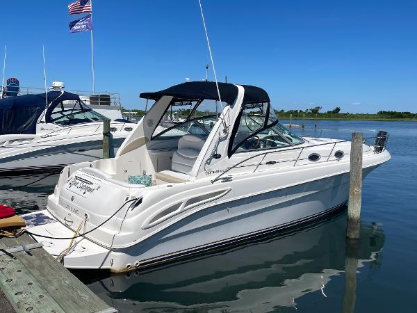 Sea Ray 340 Sundancer 2002 Sea Ray 340 Sundancer docked at marina on a sunny day.