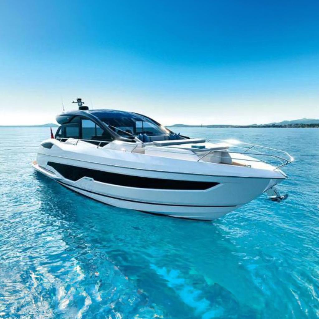 Sunseeker Predator 55 Sunseeker Predator 55 yacht, 2021 model, cruising on clear blue water under a bright sky.