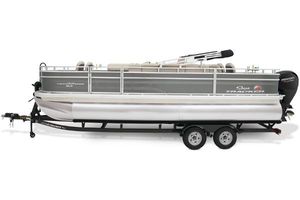 Sun Tracker Fishin' Barge 22 DLX 2025 Sun Tracker Fishin' Barge 22 DLX pontoon boat on trailer, side view.