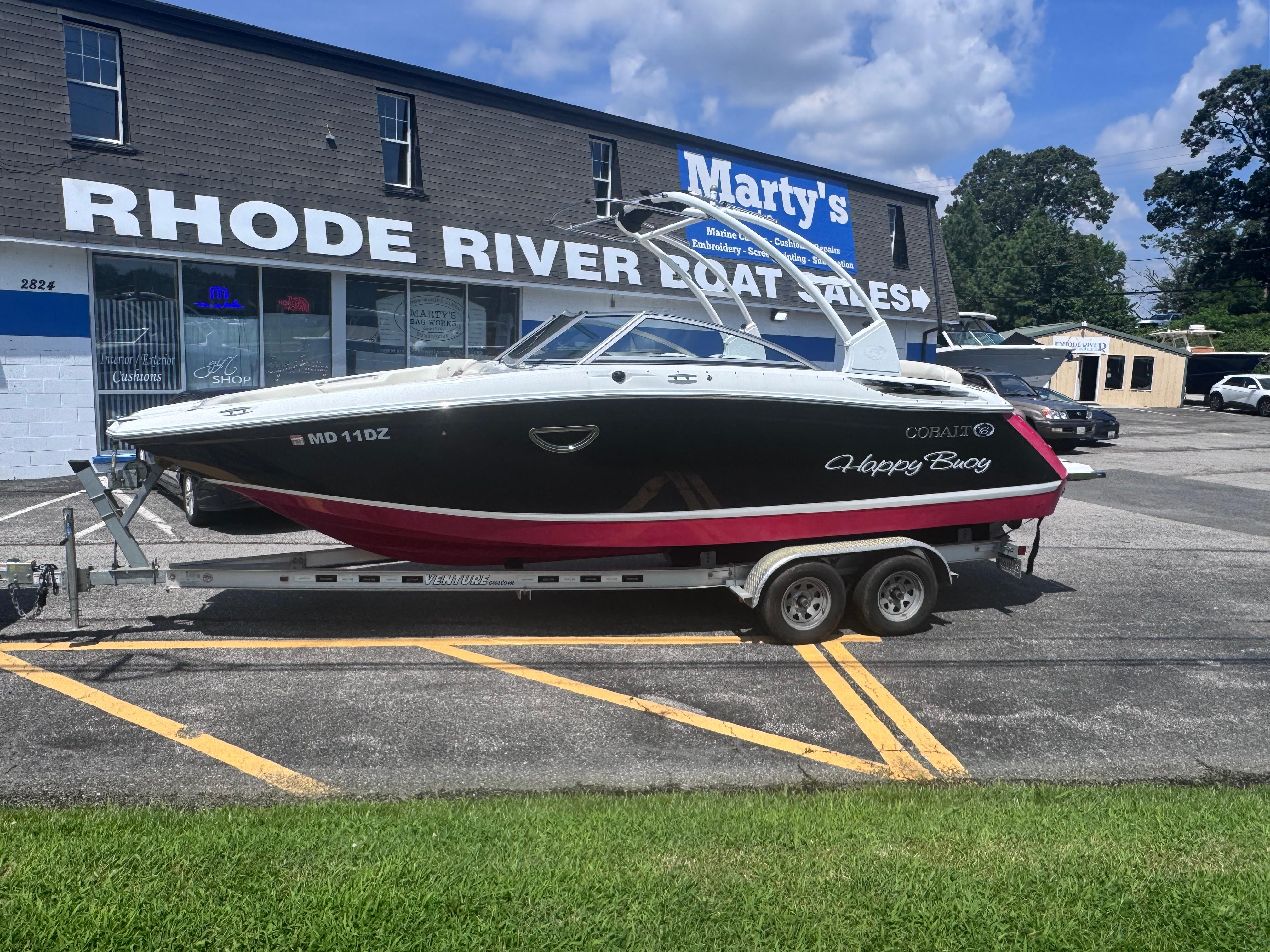 Cobalt 24SD 2013 Cobalt 24SD boat on trailer at Rhode River Boat Sales.