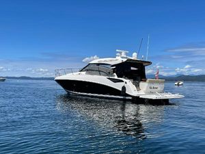 Sea Ray 470 Sundancer 2015 Sea Ray 470 Sundancer yacht on calm blue water under clear sky.