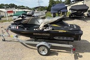 Sea-Doo GTX 155 2017 Sea-Doo GTX 155 jet ski on trailer, parked outdoors.