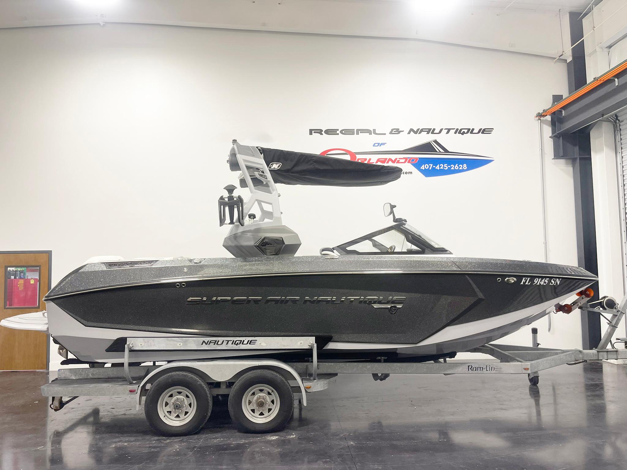 Nautique Super Air G23 2020 Nautique Super Air G23 boat on trailer in showroom.