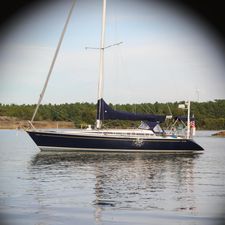 Nautor Swan 44MKII Nautor Swan 44MKII 2001 sailboat on calm water, forested shoreline in background.