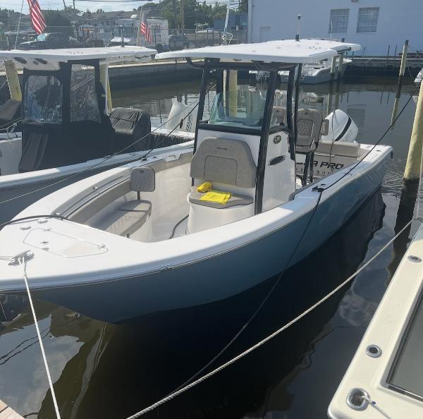 Sea Pro 239 Center Console 2022 Sea Pro 239 Center Console boat docked in marina.