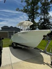 Sea Hunt Ultra 234 2016 Sea Hunt Ultra 234 boat on a trailer in a driveway.