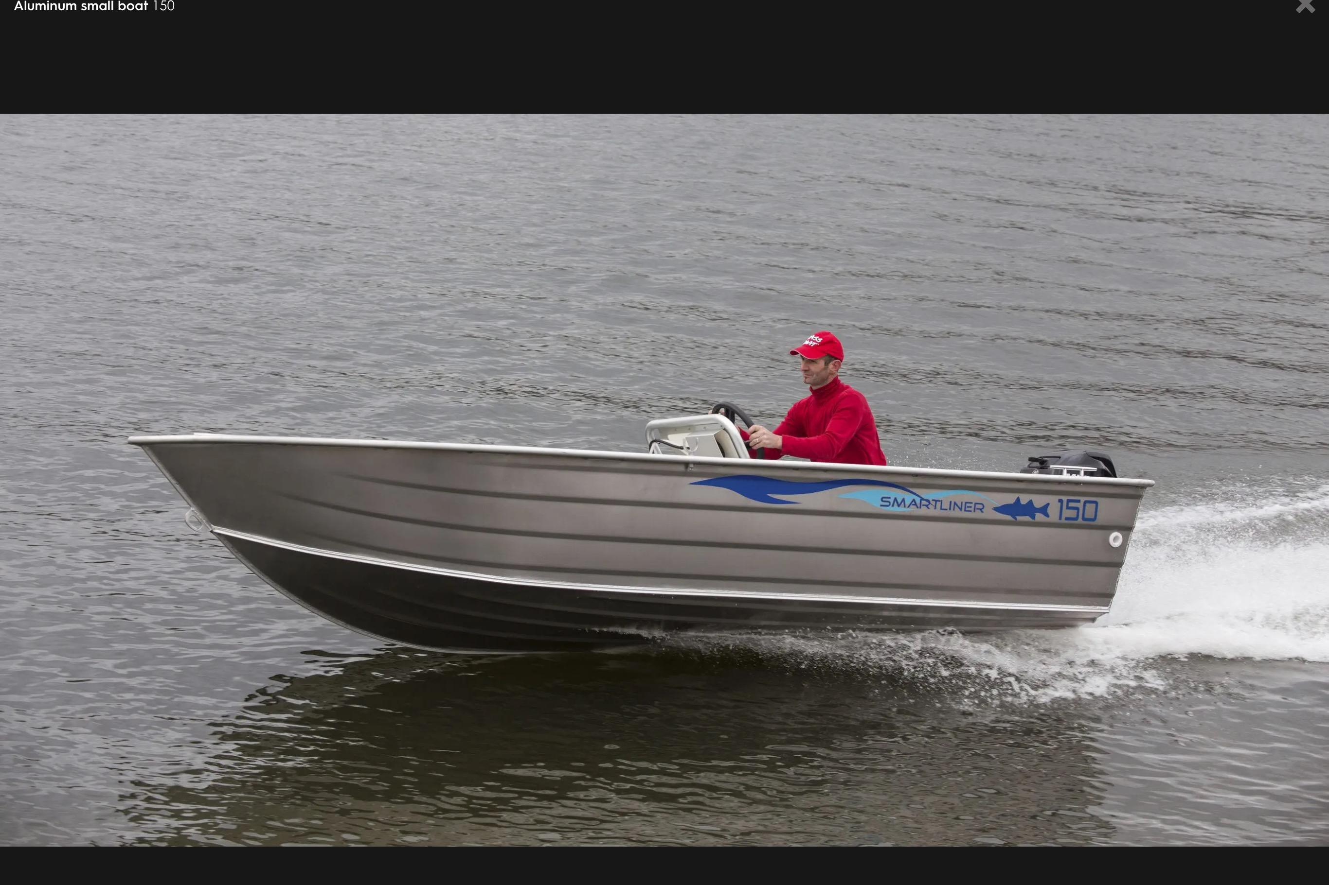 Smartliner 150 2019 Smartliner 150 aluminum boat cruising on water with driver in red attire.