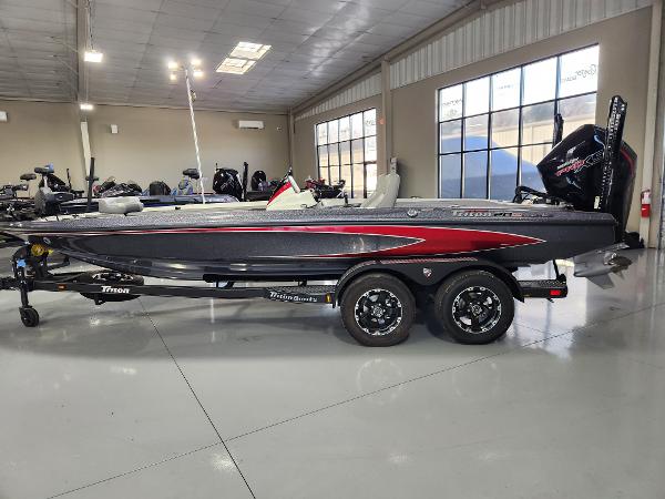 Triton 20XP Patriot 2025 Triton 20XP Patriot boat in showroom, side view.