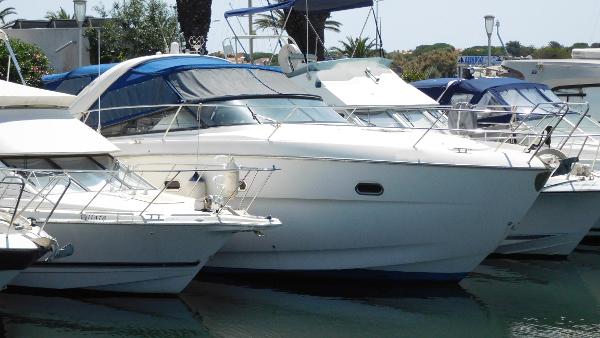 Bavaria 38 SPORT 2010 Bavaria 38 SPORT yacht docked among other boats in a marina.