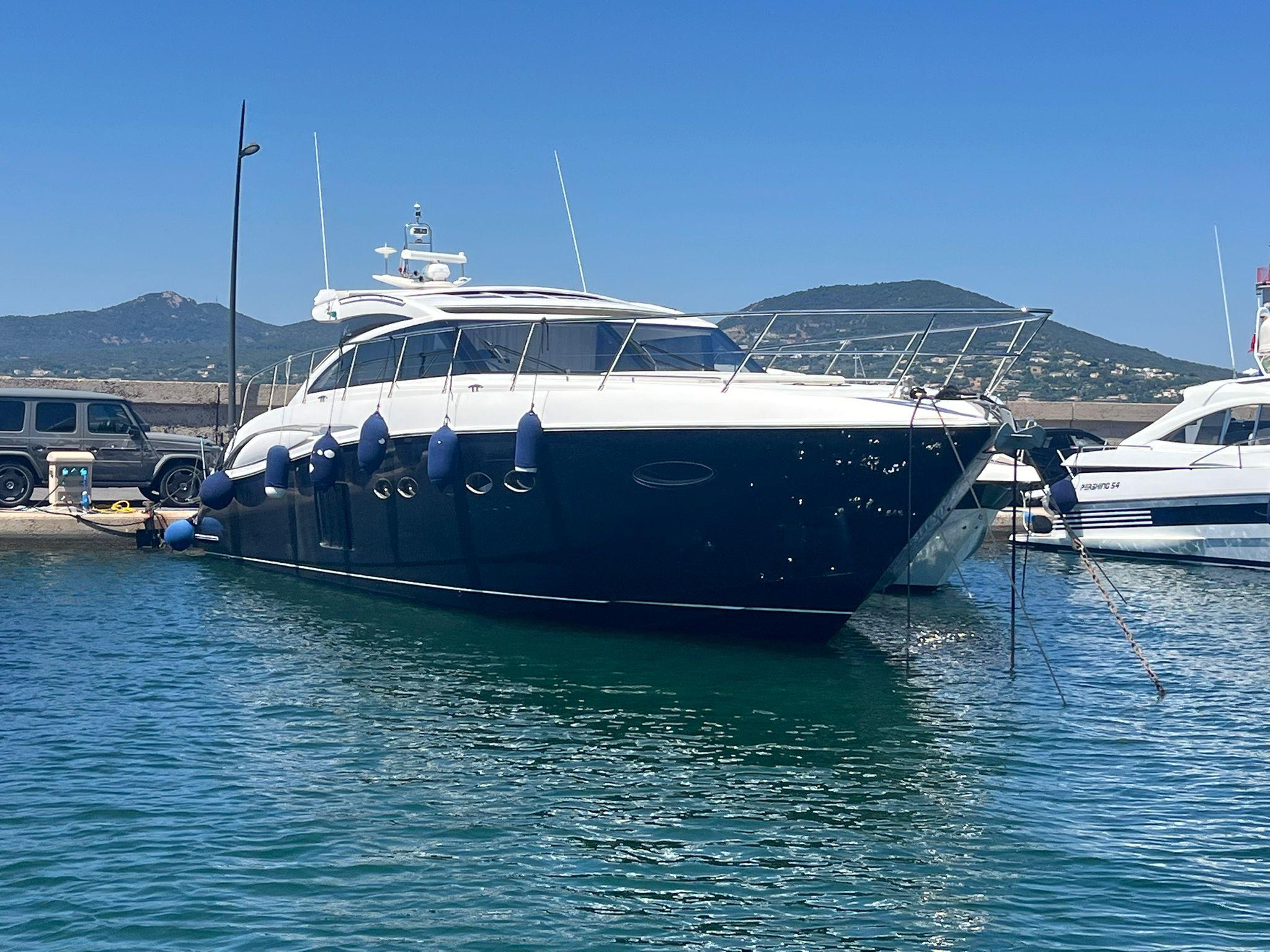 Princess V62 Luxury 2011 Princess V62 yacht docked in a scenic marina.