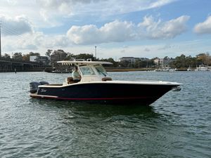 Scout 320 LXF 2014 Scout 320 LXF boat on calm water.
