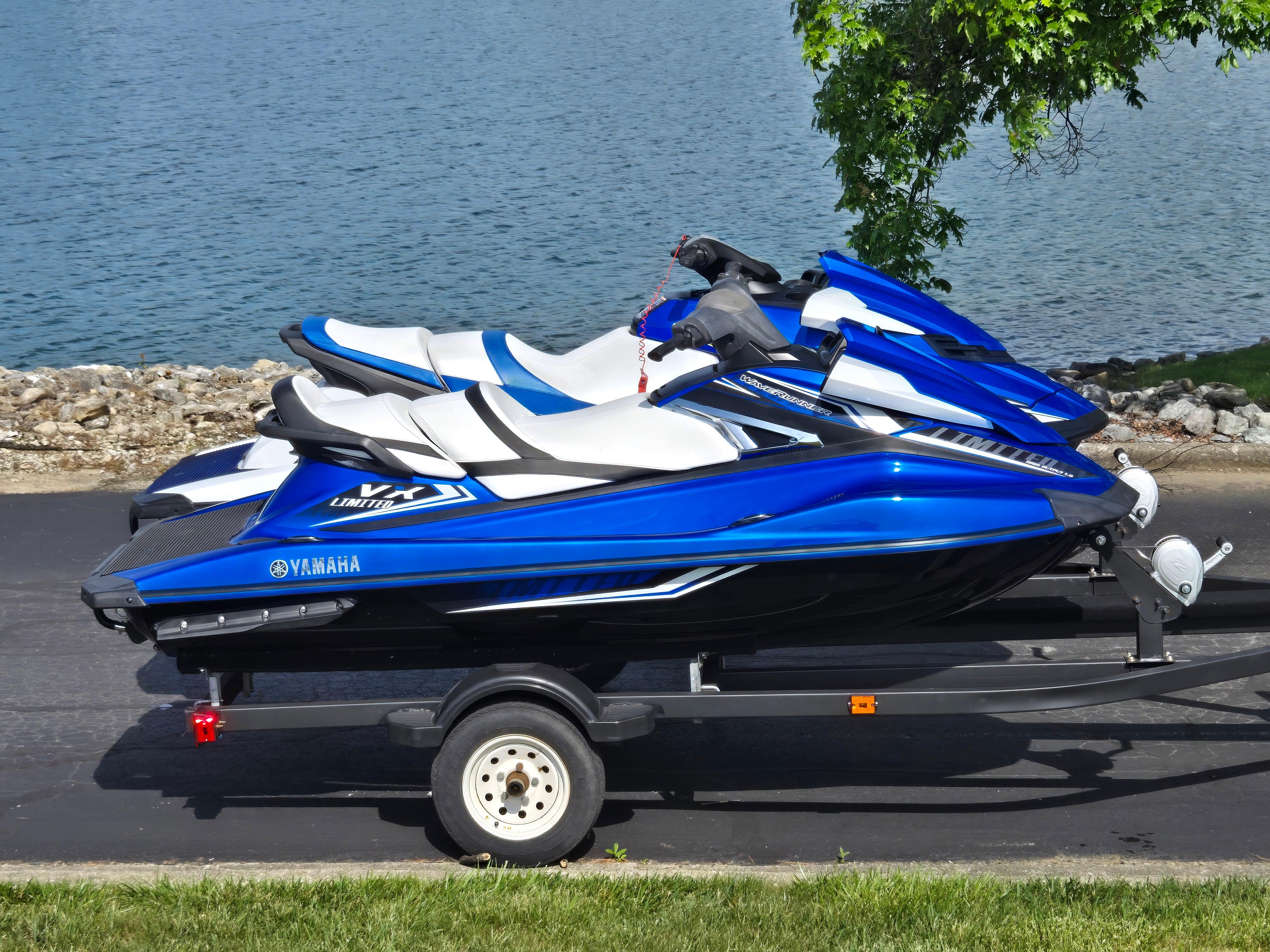 Yamaha WaveRunner VX Limited 2017 Yamaha WaveRunner VX Limited jet skis on trailer by a lake.