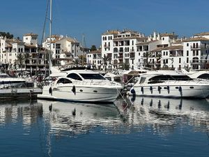 Astondoa AS 43 GLX Luxury yachts, including a 2006 Astondoa AS 43 GLX, docked in a scenic marina.
