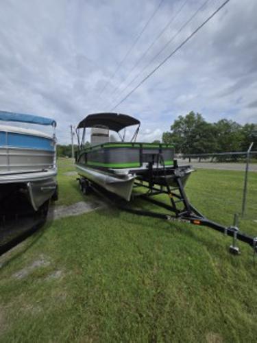 Qwest 20 XRE FISH 2025 Qwest 20 XRE FISH pontoon boat on trailer, parked on grass.