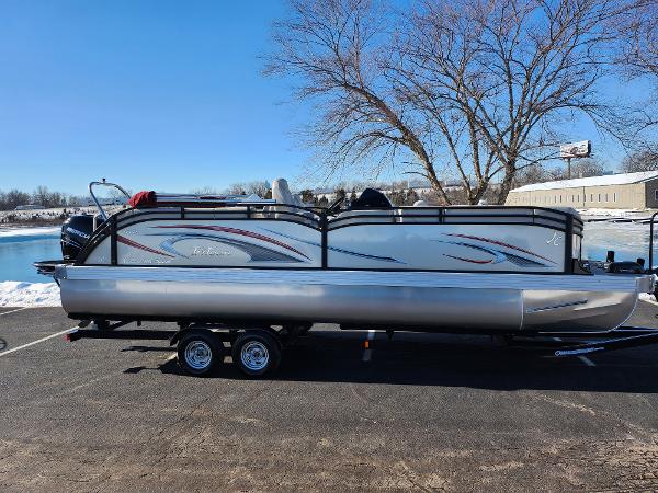JC Neptoon 25 TT DSL 2022 JC Neptoon 25 TT DSL pontoon boat on trailer, parked outdoors.