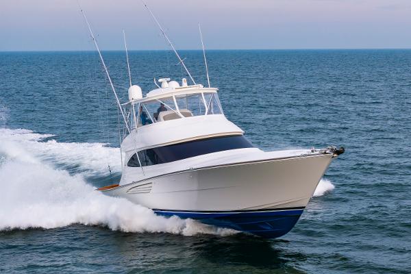Viking 64 Convertible 2024 Viking 64 Convertible yacht cruising on open sea.