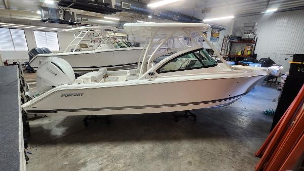 Pursuit DC 246 Dual Console 2024 Pursuit DC 246 Dual Console boat in indoor storage facility.