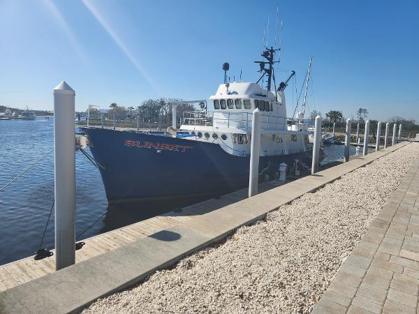DESCO 76 Trawler 1983 Custom 76 Trawler docked at a marina on a sunny day.