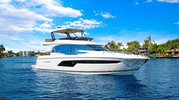Prestige 520 Fly 2024 Prestige 520 Fly yacht cruising on a sunny day with palm trees in the background.