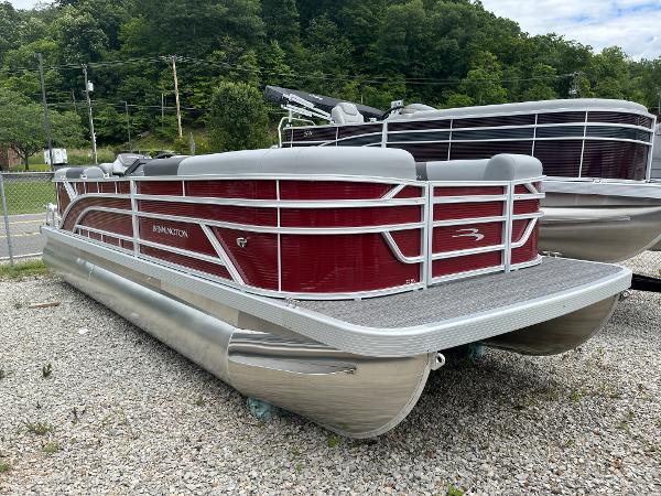 Bennington 22 SVSR 2024 Bennington 22 SVSR pontoon boat with red exterior, parked on gravel.