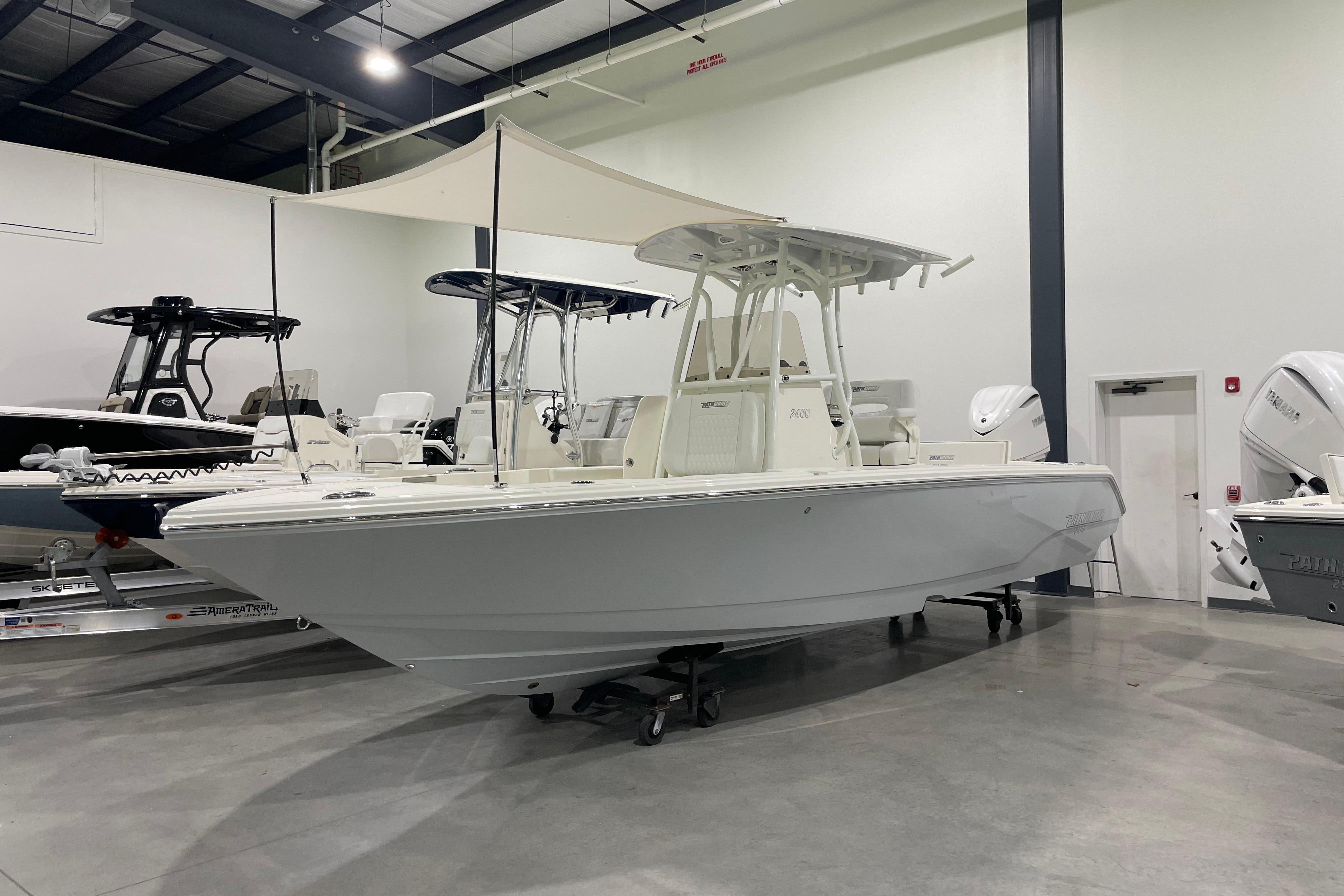 Pathfinder 2400 TRS 2026 Pathfinder 2400 TRS boat displayed indoors, featuring sleek design and modern amenities.