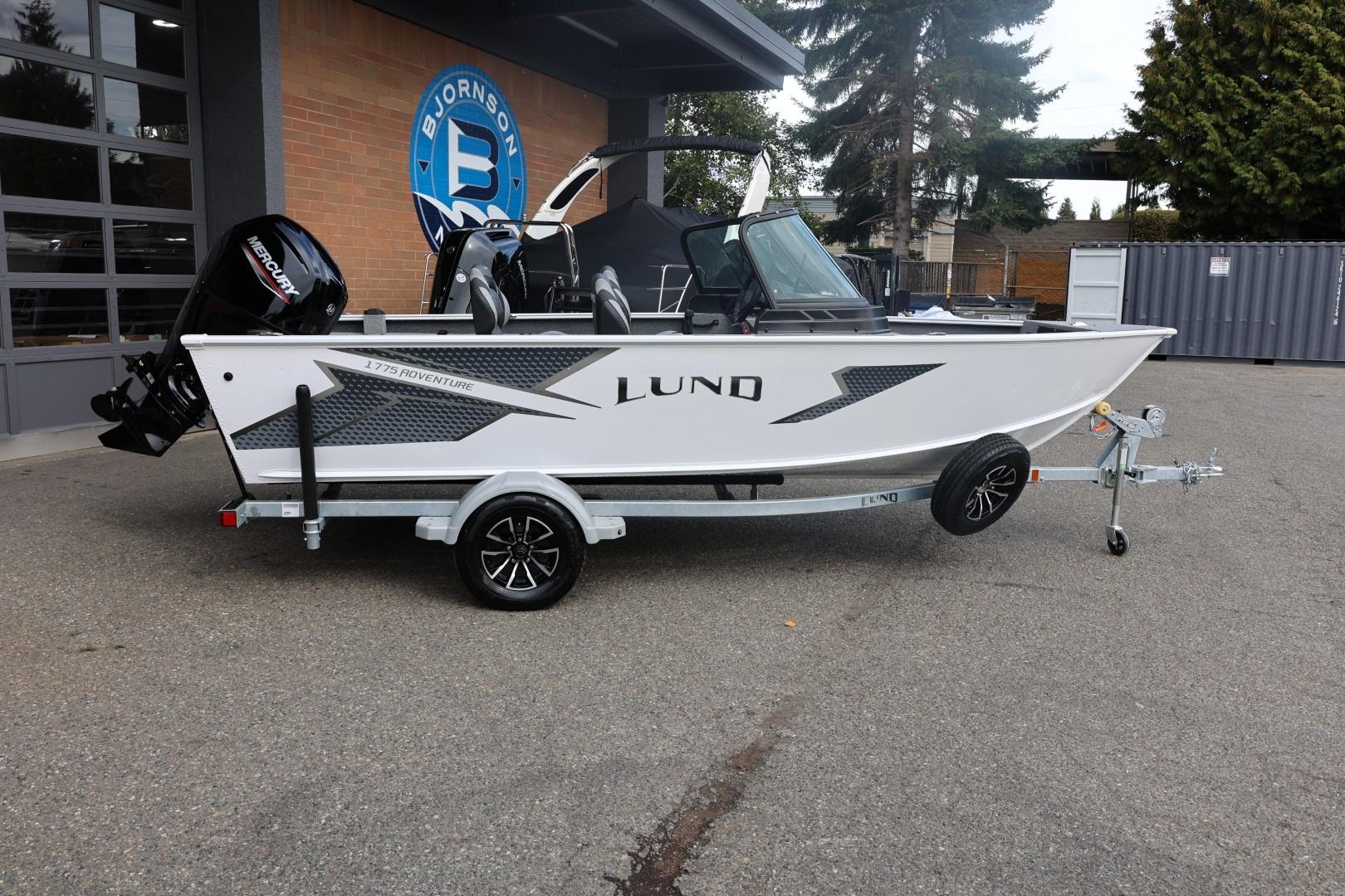 Lund 1775 Adventure Sport 2026 Lund 1775 Adventure Sport boat on trailer, parked outdoors.