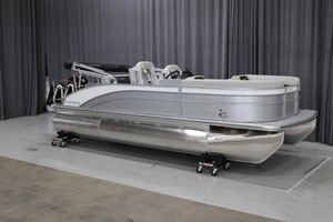 Harris Cruiser 210 2025 Harris Cruiser 210 pontoon boat in showroom, silver finish, side view.