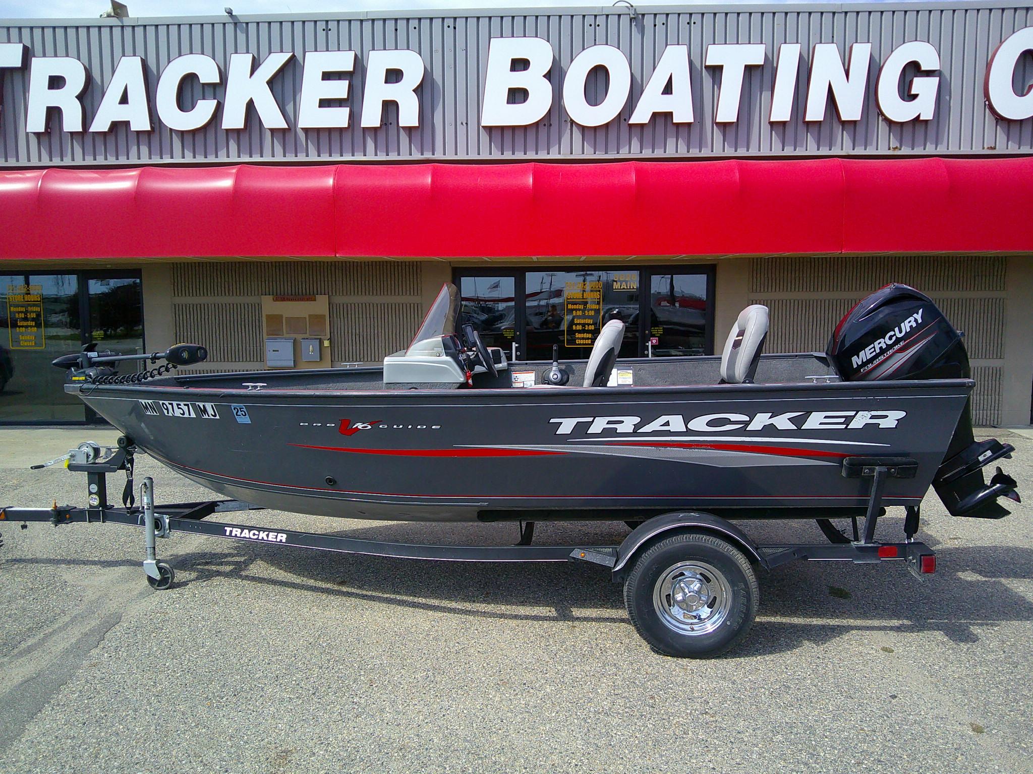 Tracker Pro Guide V-16 SC 2017 Tracker Pro Guide V-16 SC boat on trailer outside Tracker Boating Center.
