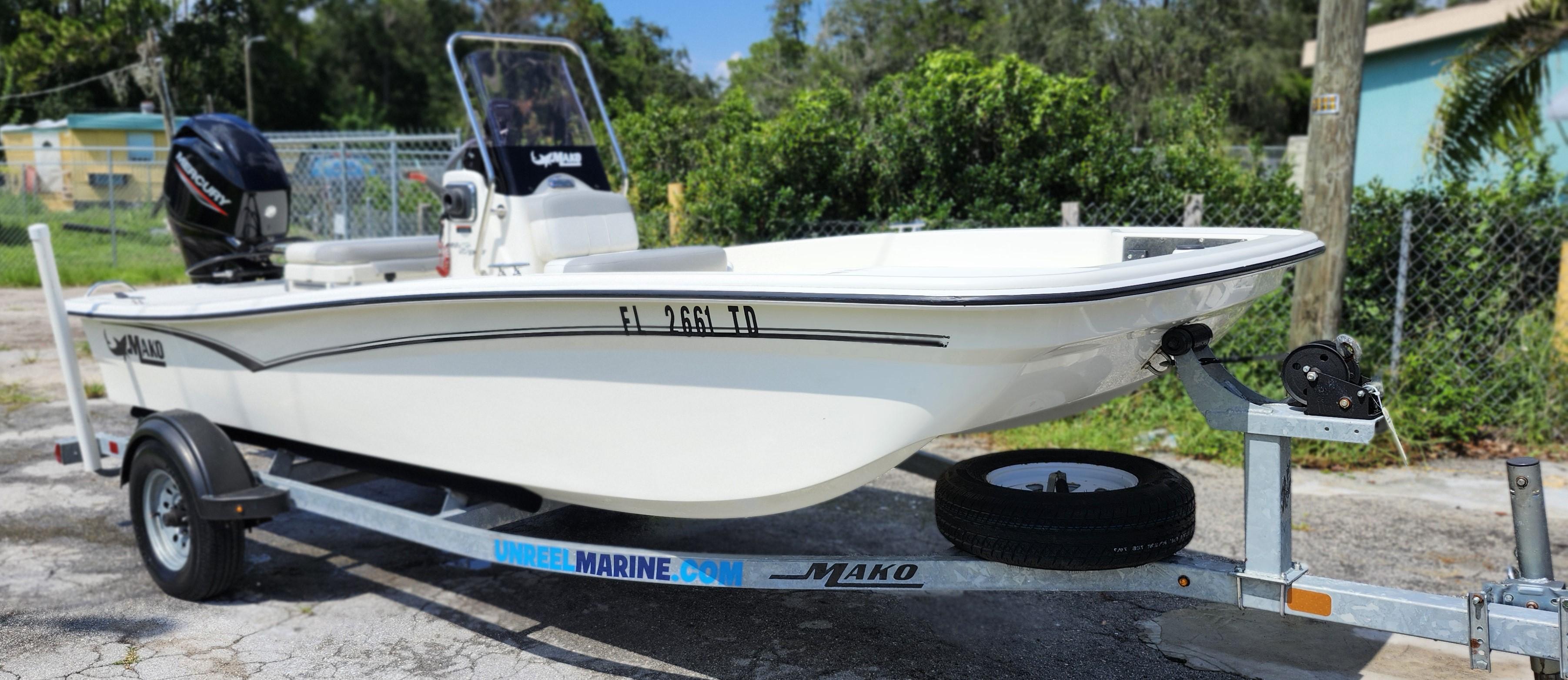 Mako Pro Skiff 15 CC 2022 Mako Pro Skiff 15 CC boat on trailer, parked outdoors.