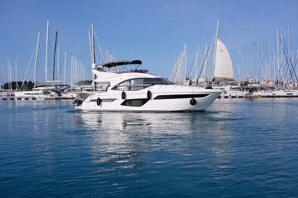 Princess F50 2020 Princess F50 yacht docked in a marina with sailboats in the background.