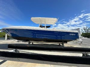 Intrepid 323 2005 Intrepid 323 boat on trailer under clear blue sky.
