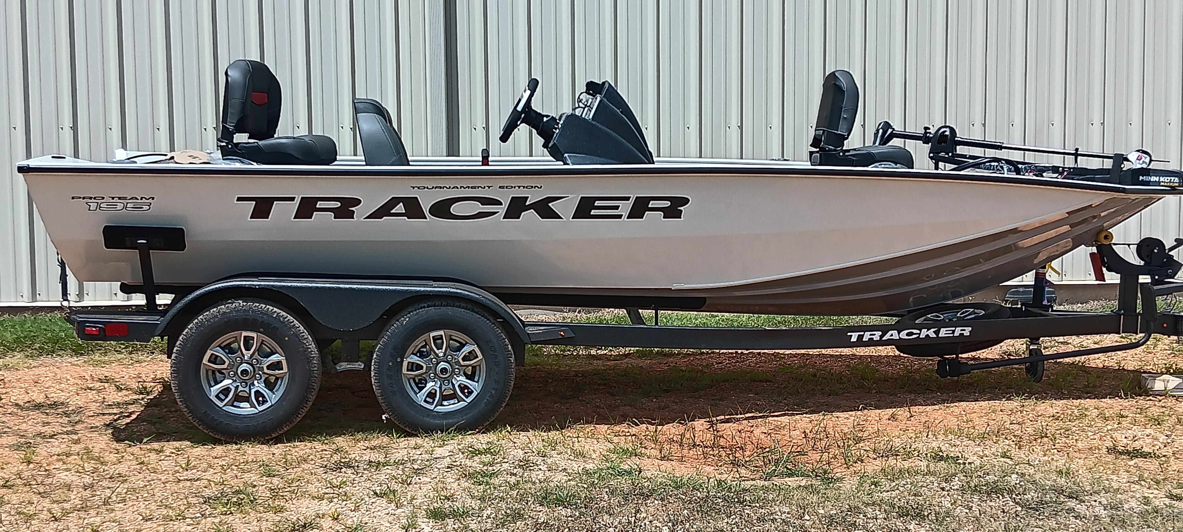 Tracker Pro Team 195 2026 Tracker Pro Team 195 boat on trailer, parked outdoors, side view.