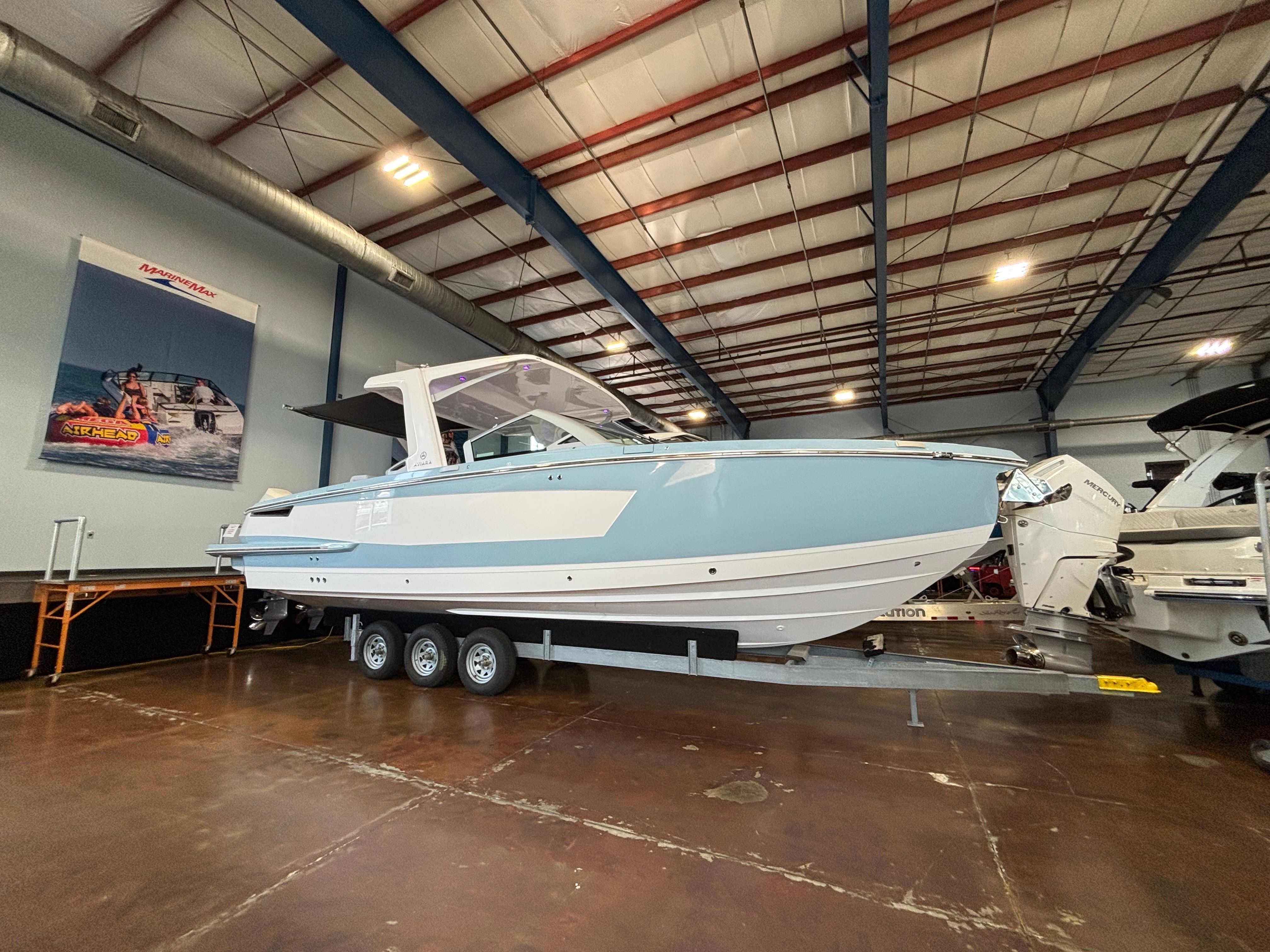 Aviara AV32 Outboard 2024 Aviara AV32 Outboard boat displayed indoors on a trailer.