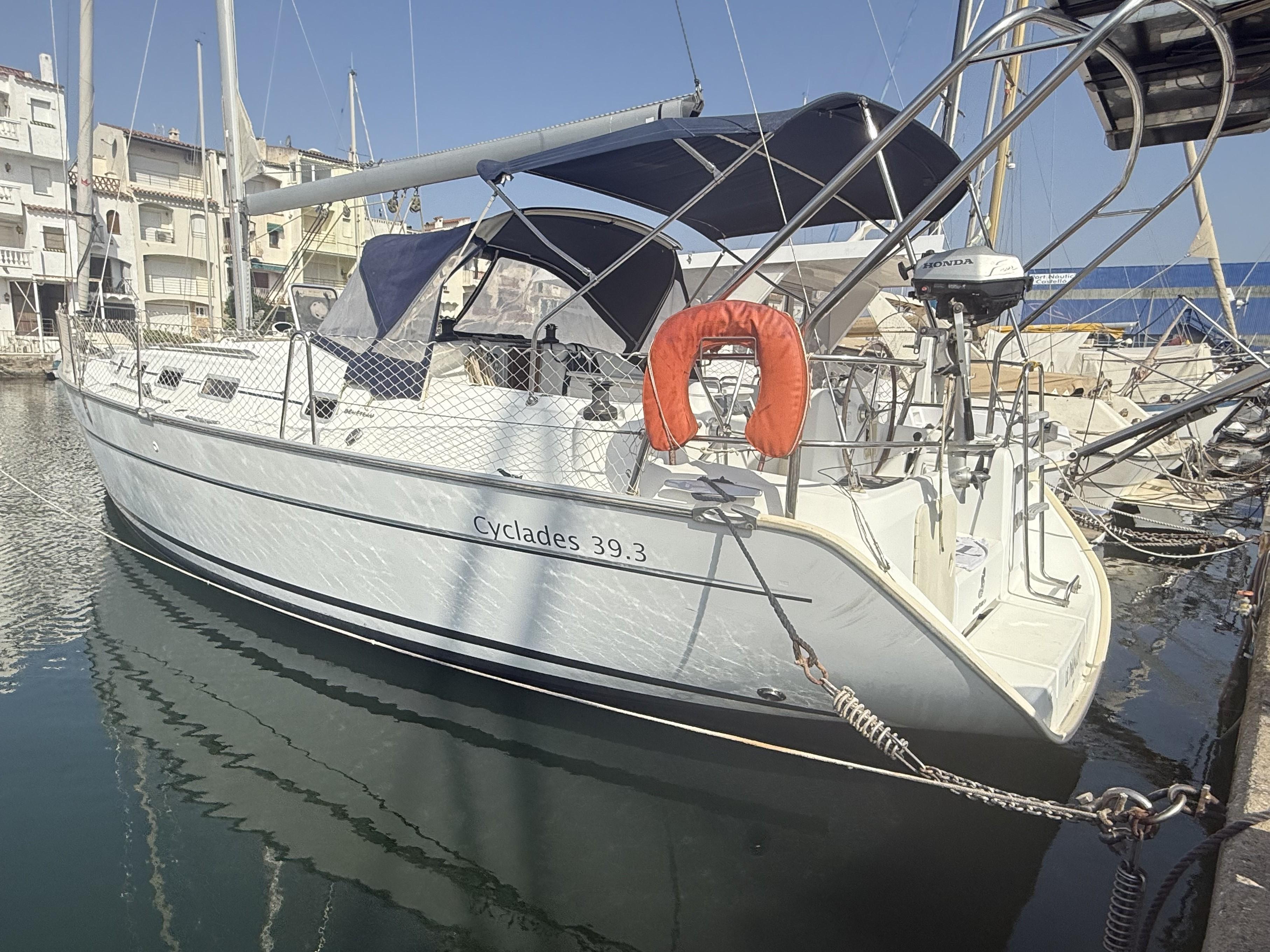 Beneteau Cyclades 39 2007 Beneteau Cyclades 39.3 sailboat docked in marina, featuring blue canopy and lifebuoy.