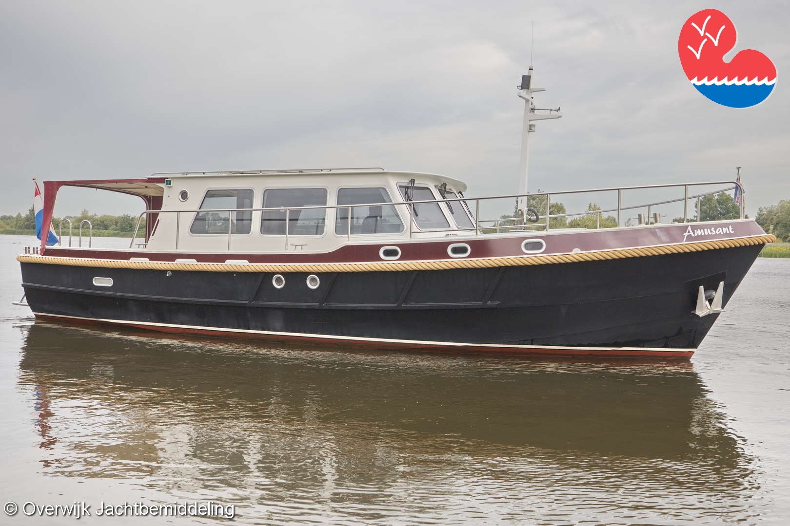 Barkas 1150 1999 Barkas 1150 yacht on calm water, featuring sleek design and Dutch flag.