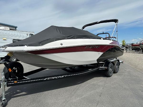 Starcraft SVX 211 OB 2024 Starcraft SVX 211 OB boat on trailer with cover, side view.