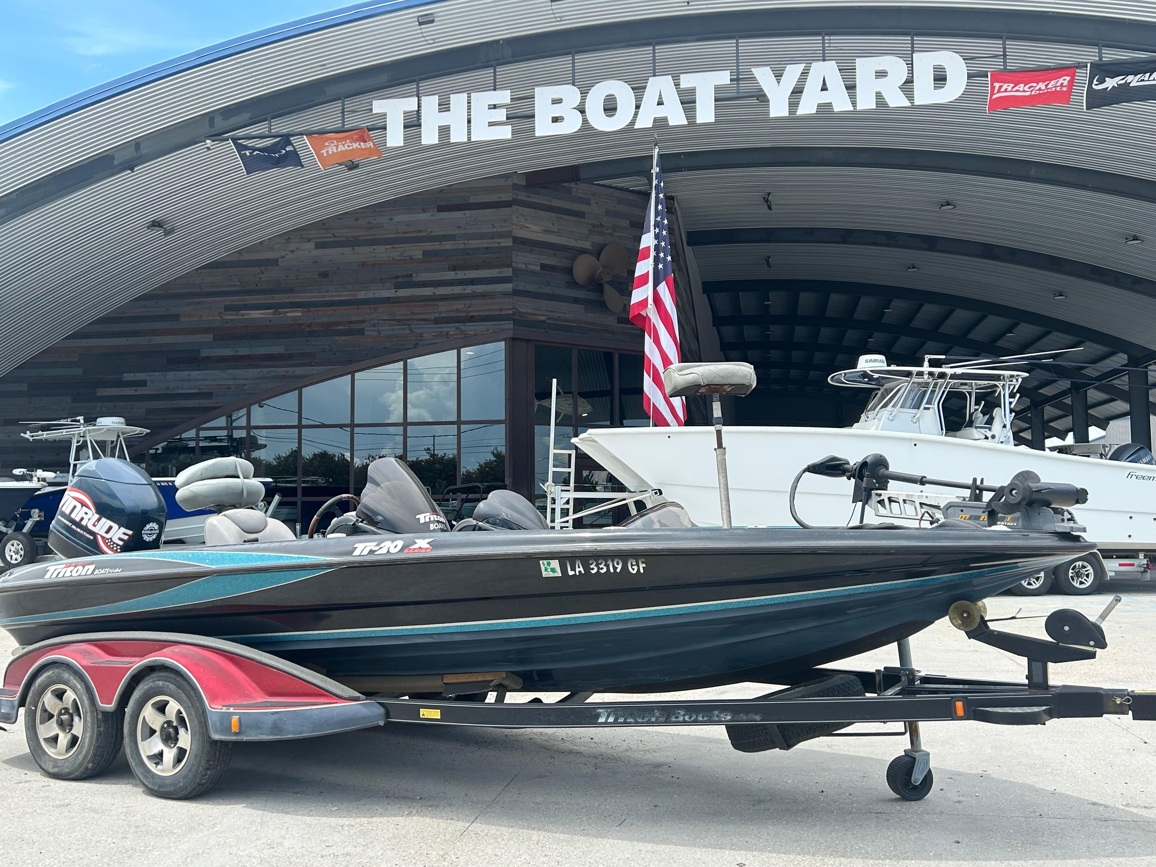 Triton Tr-20XDC 2004 Triton Tr-20XDC boat on trailer at The Boat Yard dealership.