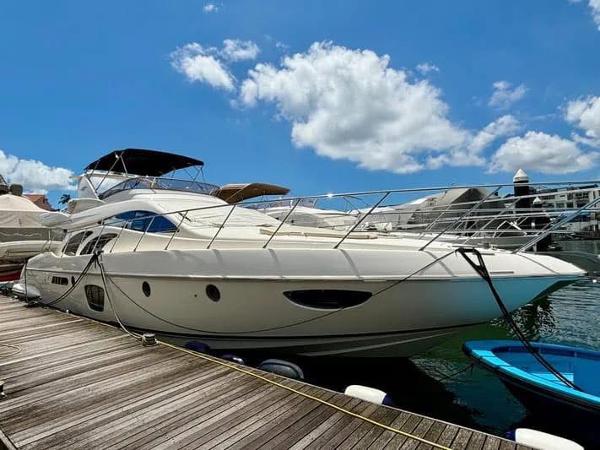 Azimut 62 Evolution 2008 Azimut 62 Evolution yacht docked under a clear blue sky.