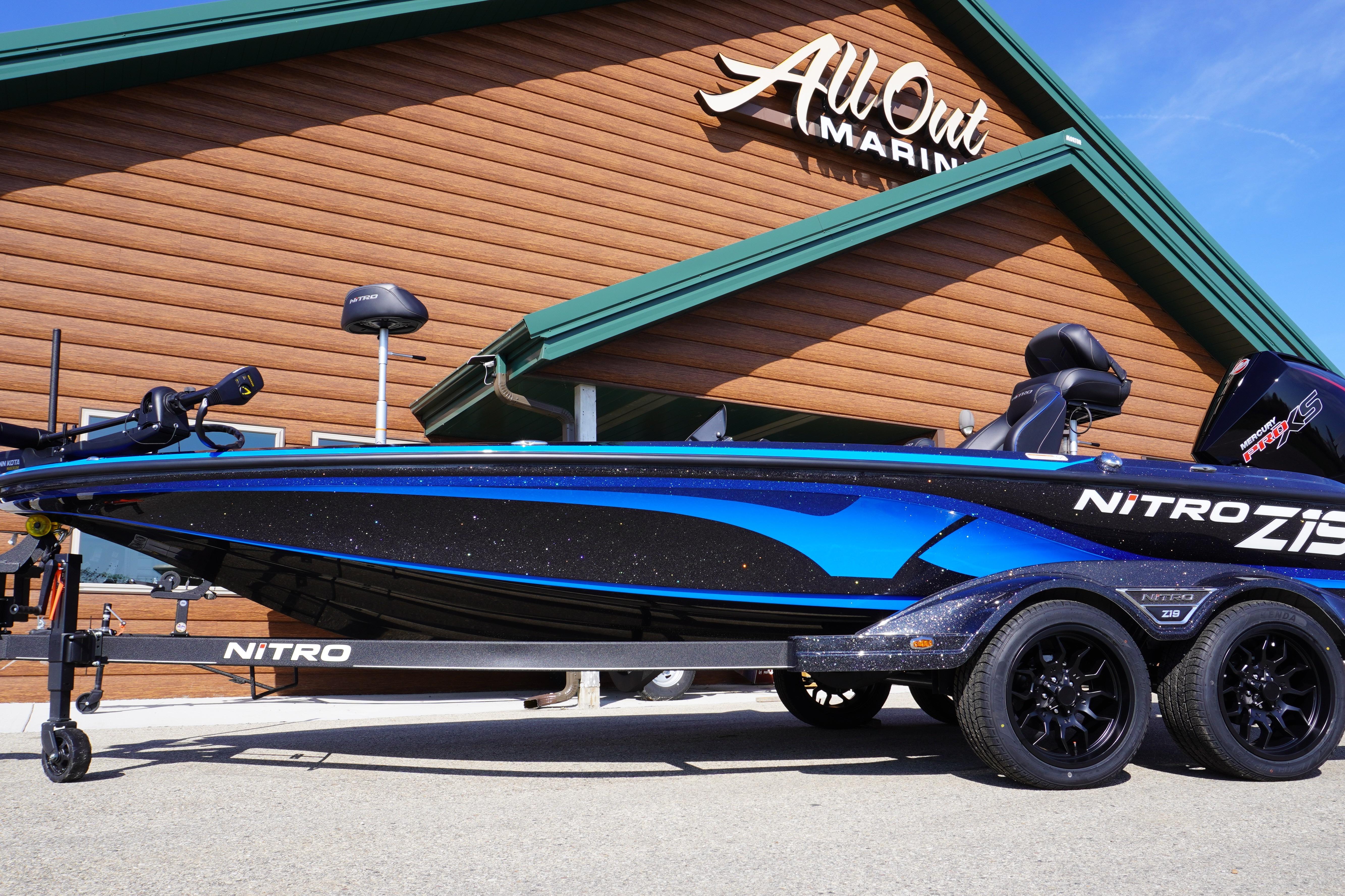 Nitro Z19 2024 Nitro Z19 boat at All Out Marine dealership, showcasing sleek design and vibrant blue accents.