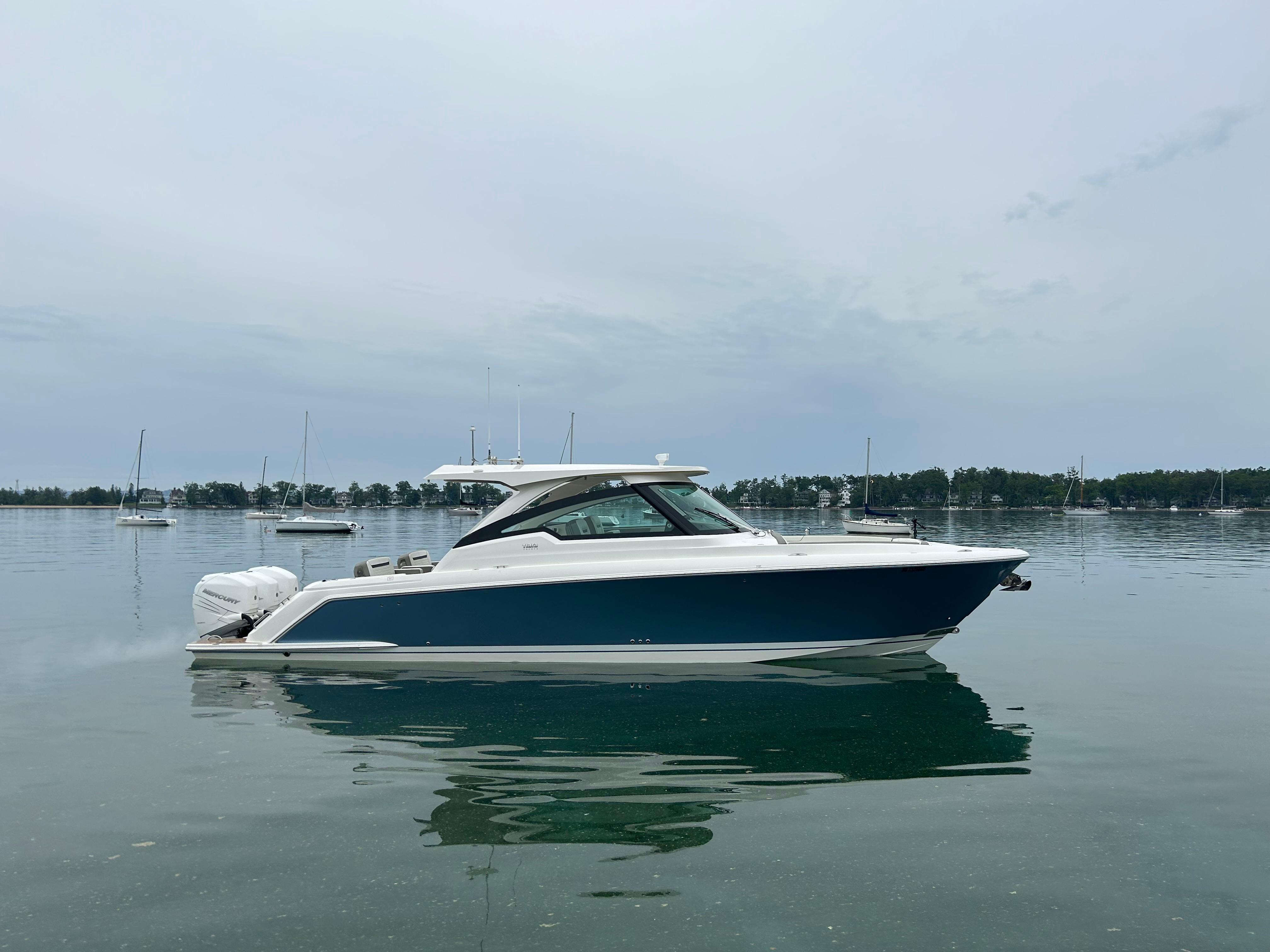 Tiara Yachts 38 LX 2022 Tiara Yachts 38 LX on calm water, side view.