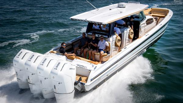 Nor-Tech 500 Sport Center Console 2026 Nor-Tech 500 Sport Center Console cruising on the ocean with multiple passengers.