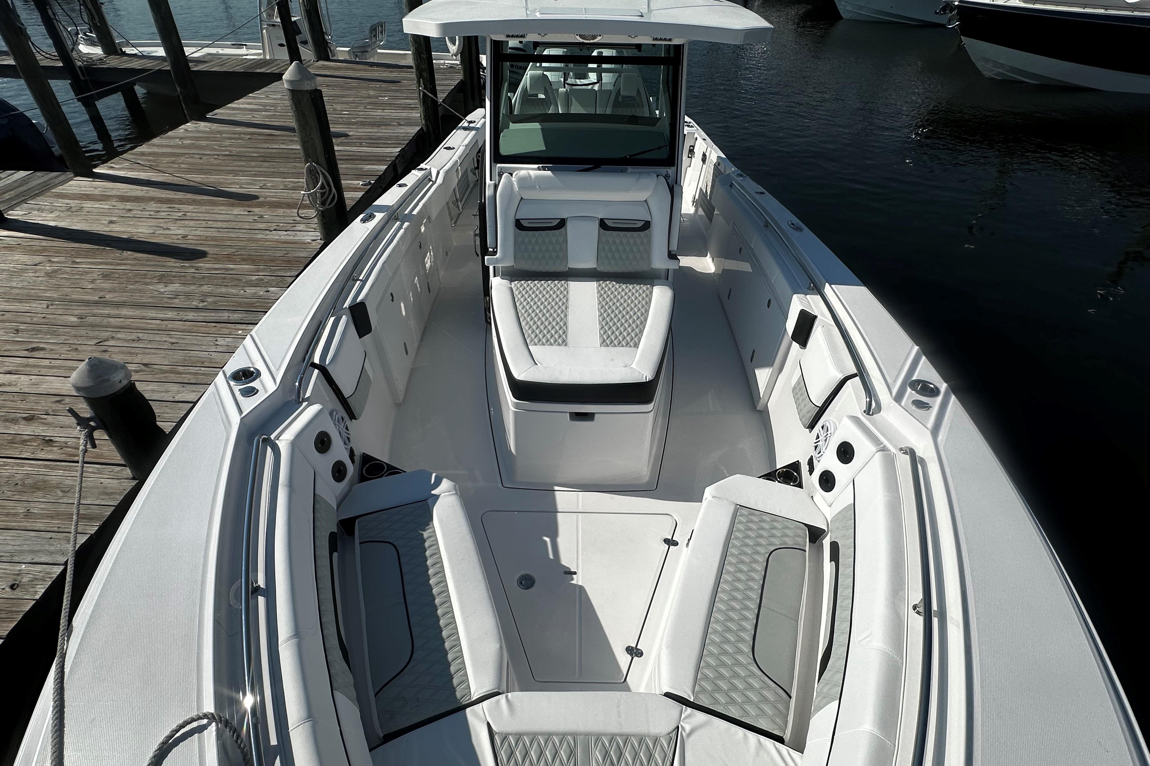 Blackfin 332 CC 2025 Blackfin 332 CC boat interior with luxurious seating and modern design at a dock.