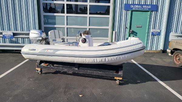 AB Inflatables Alumina 10 ALX 2023 AB Inflatables Alumina 10 ALX boat on a trailer outside a marine service center.