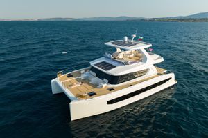 Custom Omaya 50 Power Catamaran Luxurious 2025 Omaya 50 Power Catamaran cruising on open sea, showcasing modern design and spacious deck.