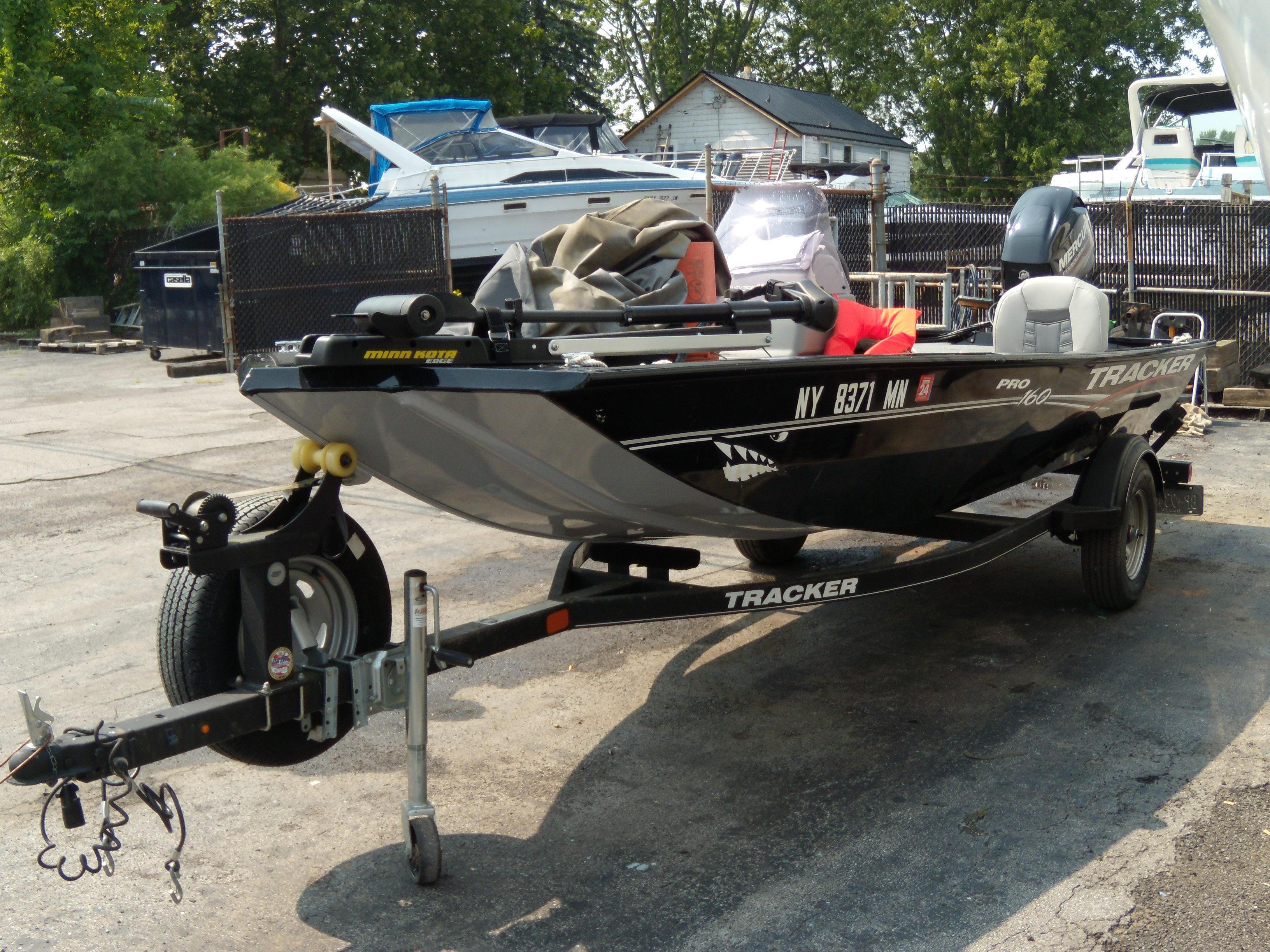 Tracker Pro 160 2018 Tracker Pro 160 boat on trailer in outdoor storage area.