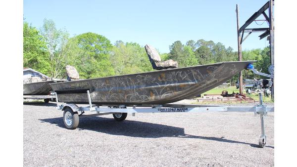 War Eagle 648LDV Sportsman 2025 War Eagle 648LDV Sportsman boat on trailer, outdoors, with camouflage design.