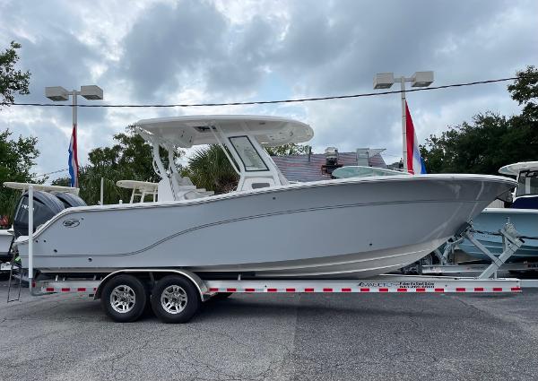 Sea Fox 288 Commander 2024 Sea Fox 288 Commander boat on a trailer, displayed outdoors under cloudy skies.
