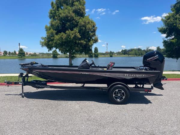 Ranger RT178C 2024 Ranger RT178C fishing boat on trailer by a lake.