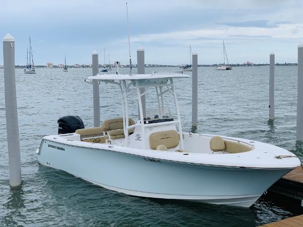 Sportsman Open 232 Center Console 2019 Sportsman Open 232 Center Console boat docked on calm water.